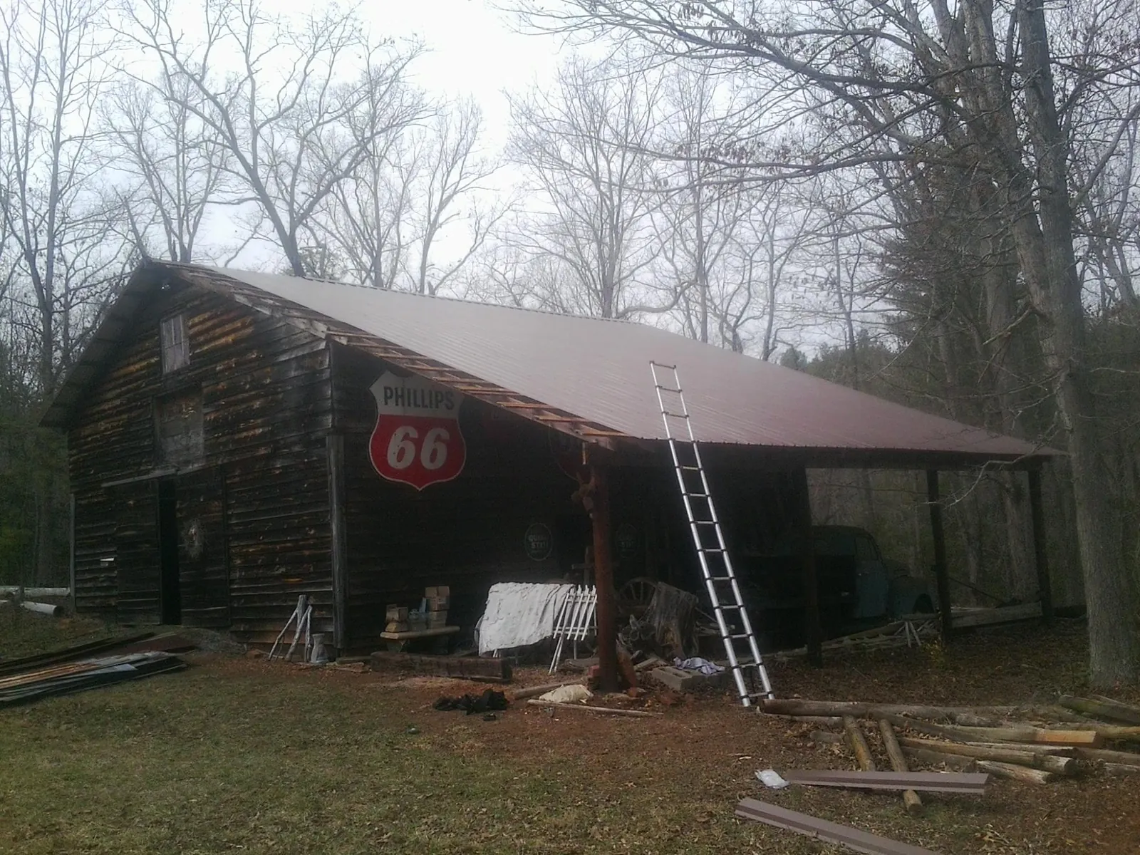 New metal roof on an open sided timber barn with a vintage sign in Eltopia